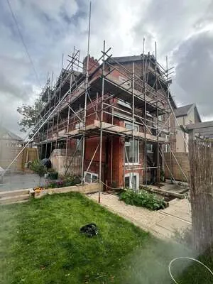 One of our scaffolding projects: scaffolding around a red-brick semi-detached house