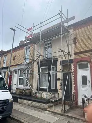 Scaffolding with a loading bay on the front of a Victorian terraced house