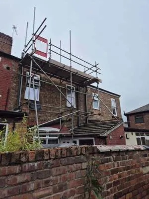 Chimney access scaffolding above a terraced house roof