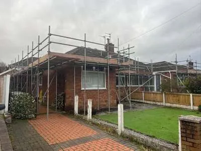 Scaffolding around the roof of a bungalow